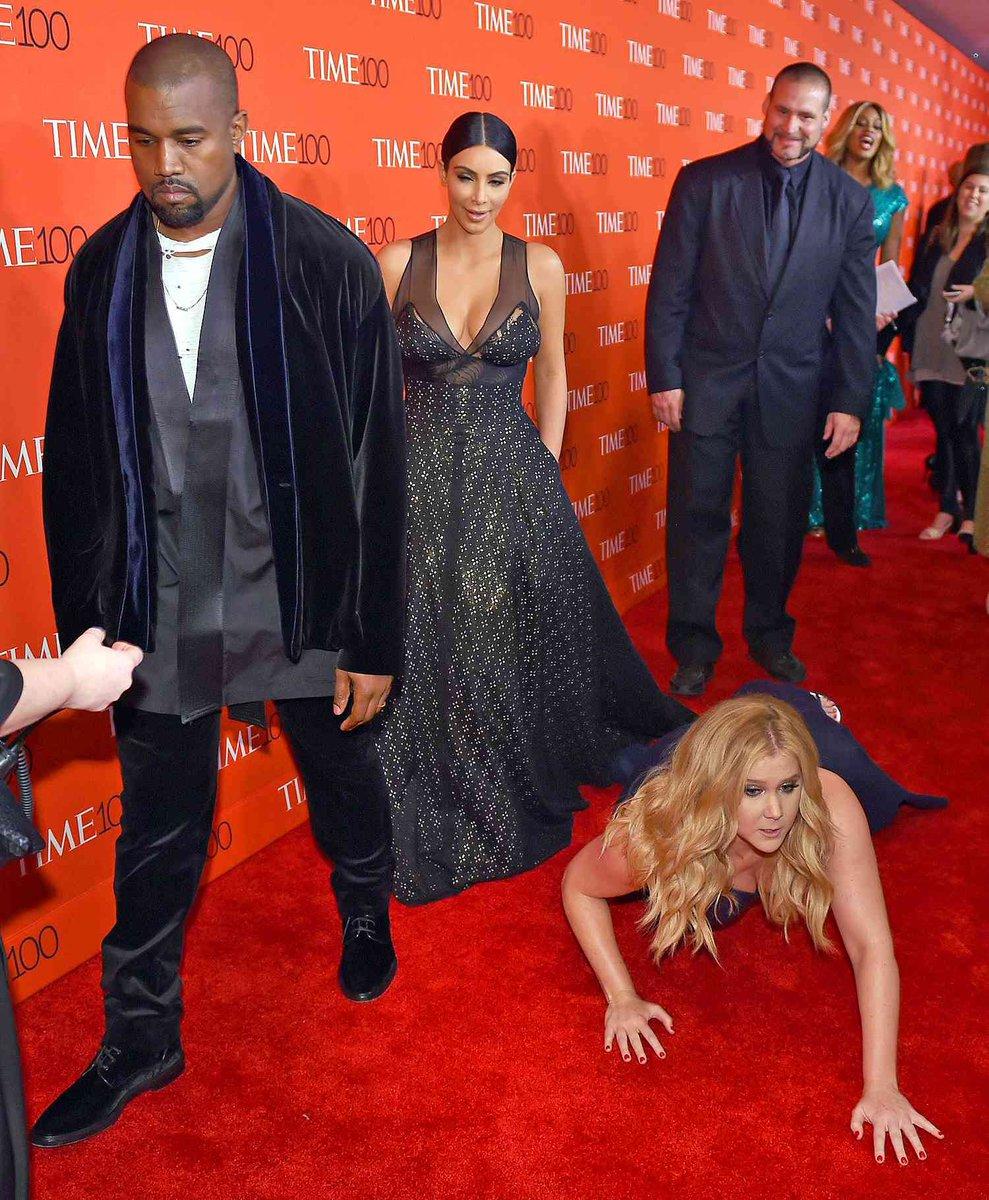 Kanye West and Kim Kardashian Walk Past Amy Schumers Fall.jpg